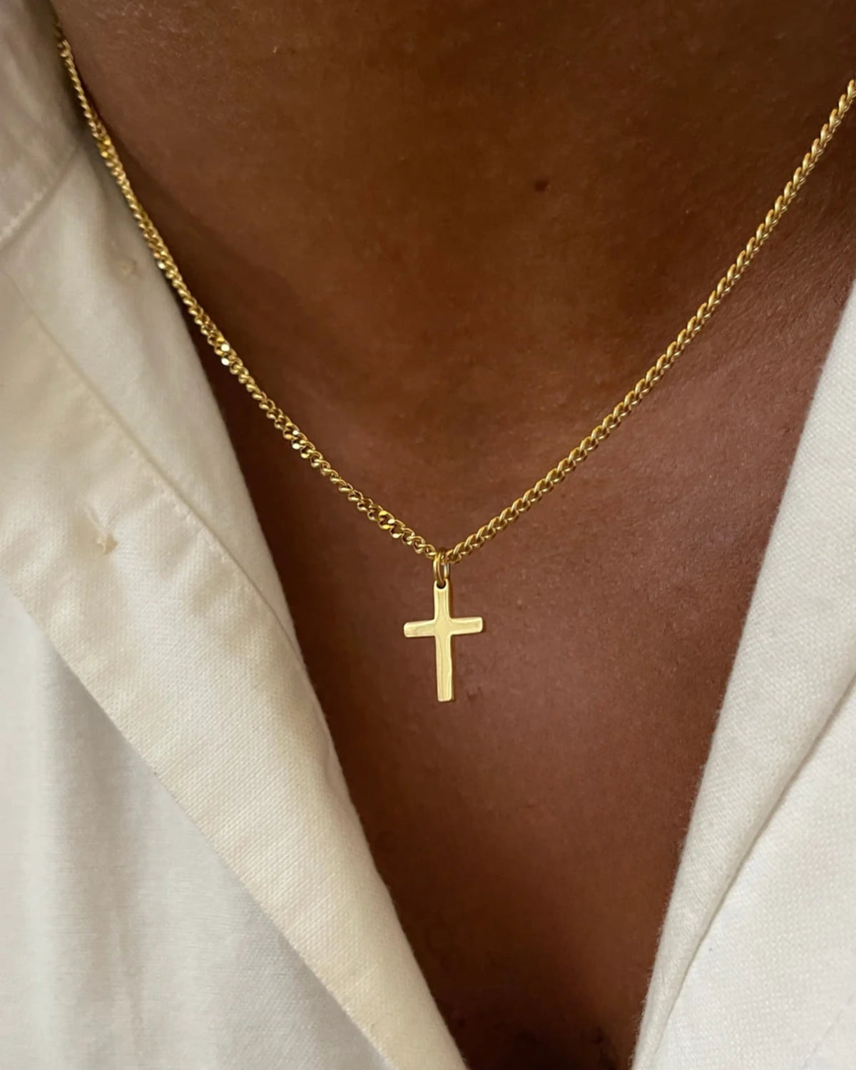 Gold cross chain on model image