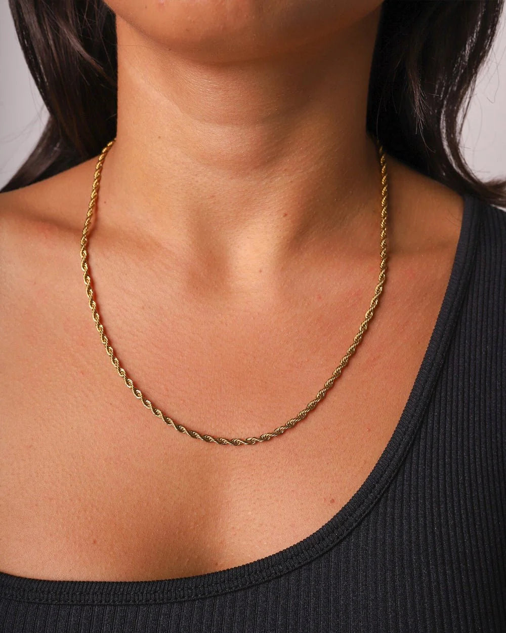 Gold rope chain necklace close up photo