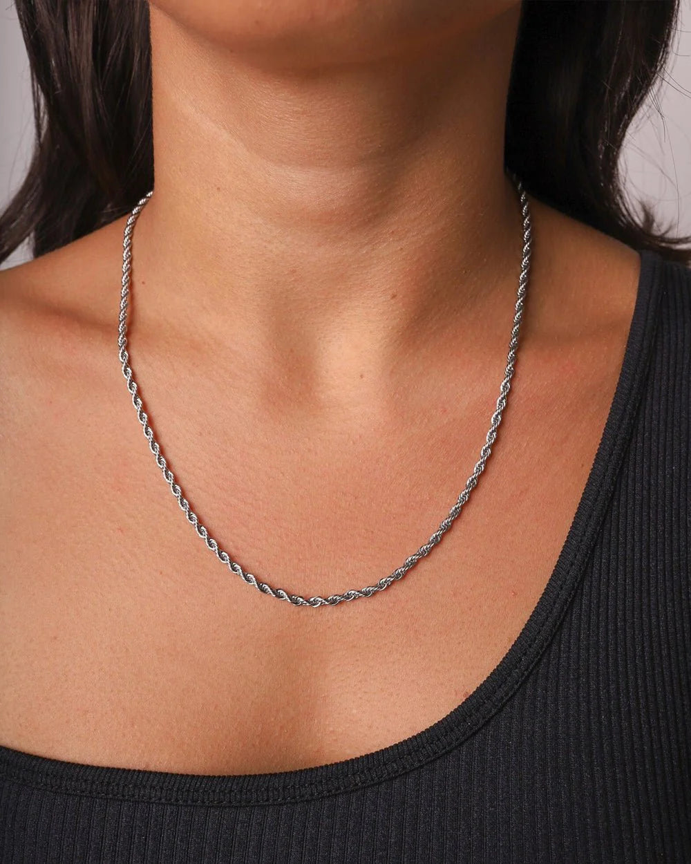 Silver rope chain necklace close up photo