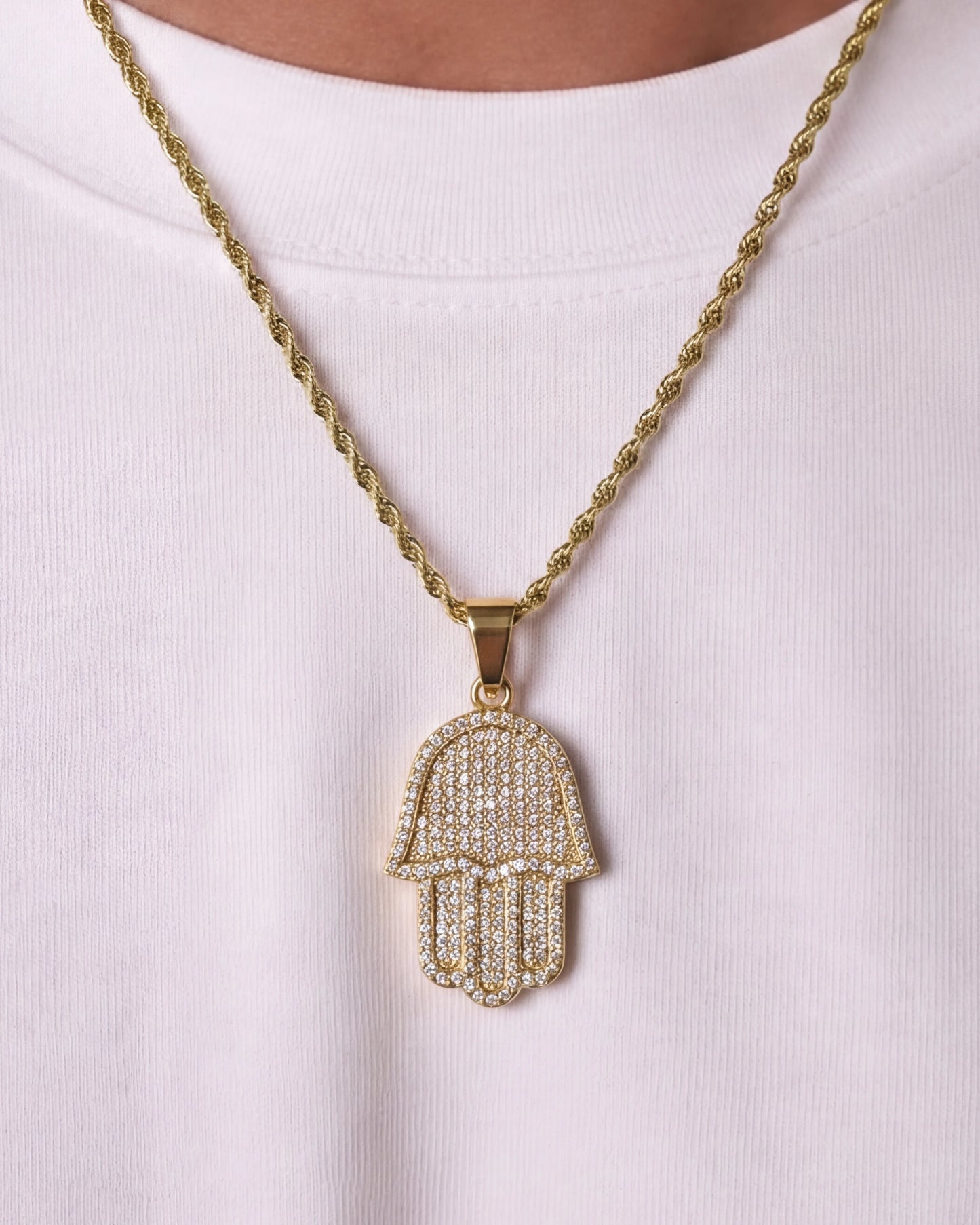 Hamsa hand chain gold on model close up photo